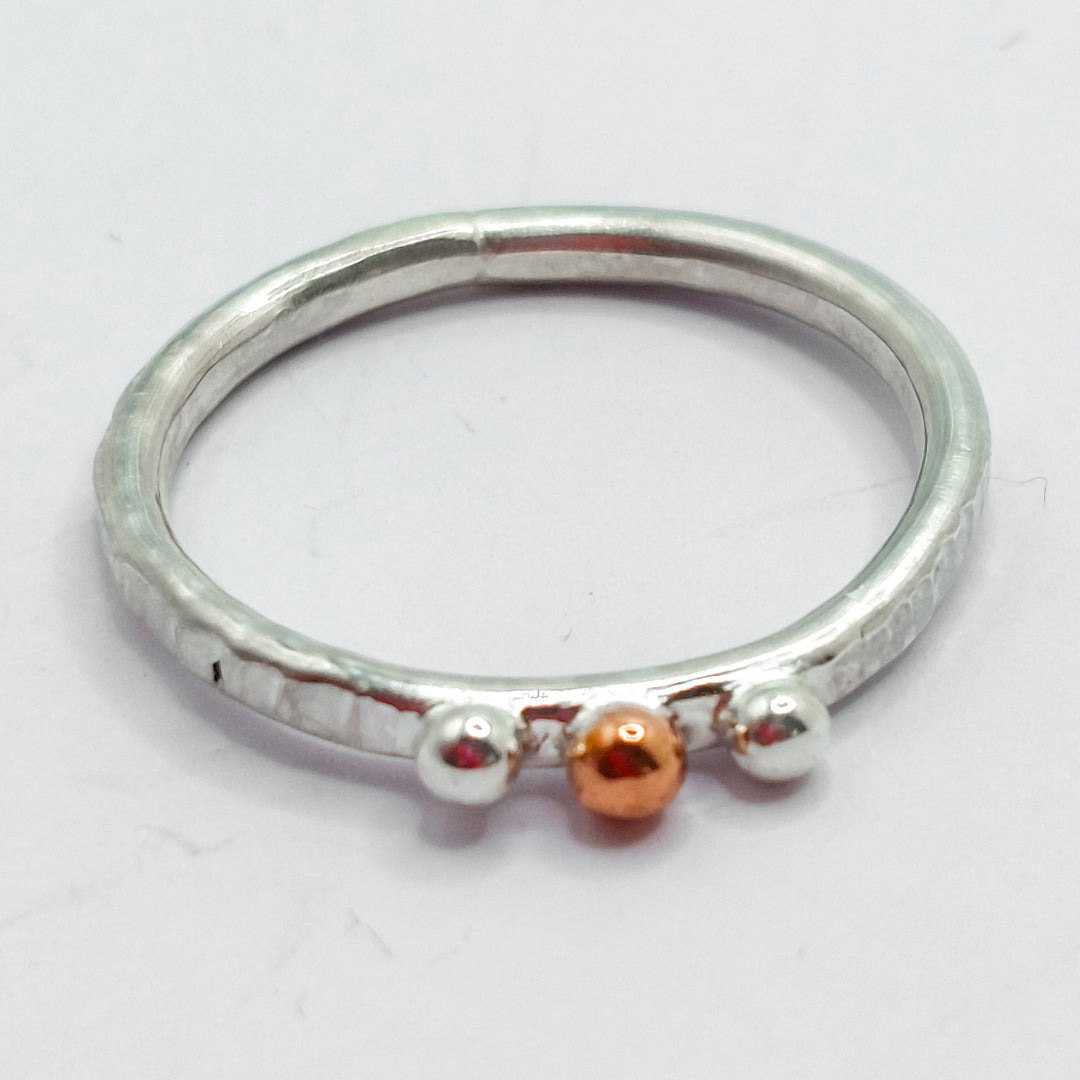 Silver and Copper Pebbles on Textured Ring