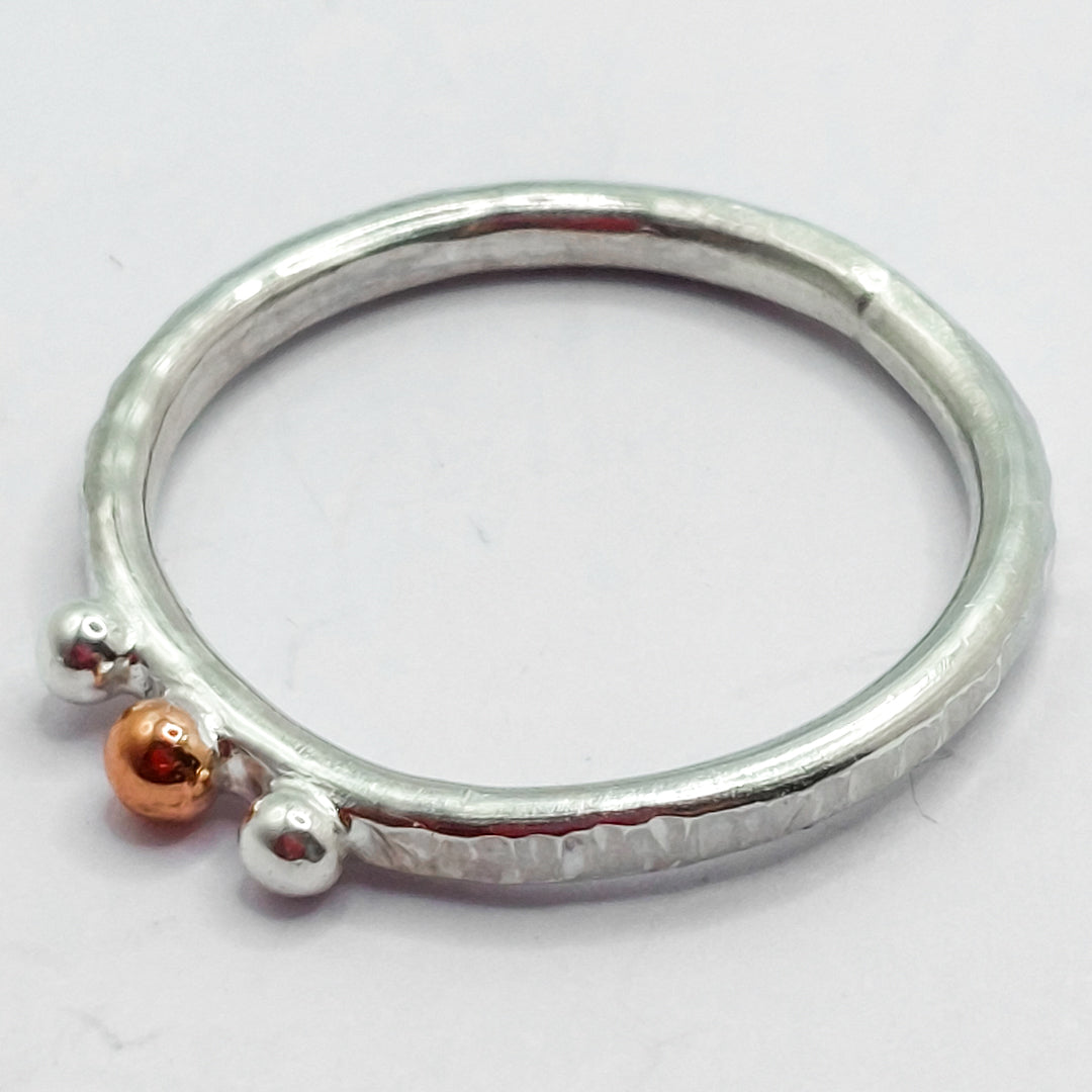 Silver and Copper Pebbles on Textured Ring