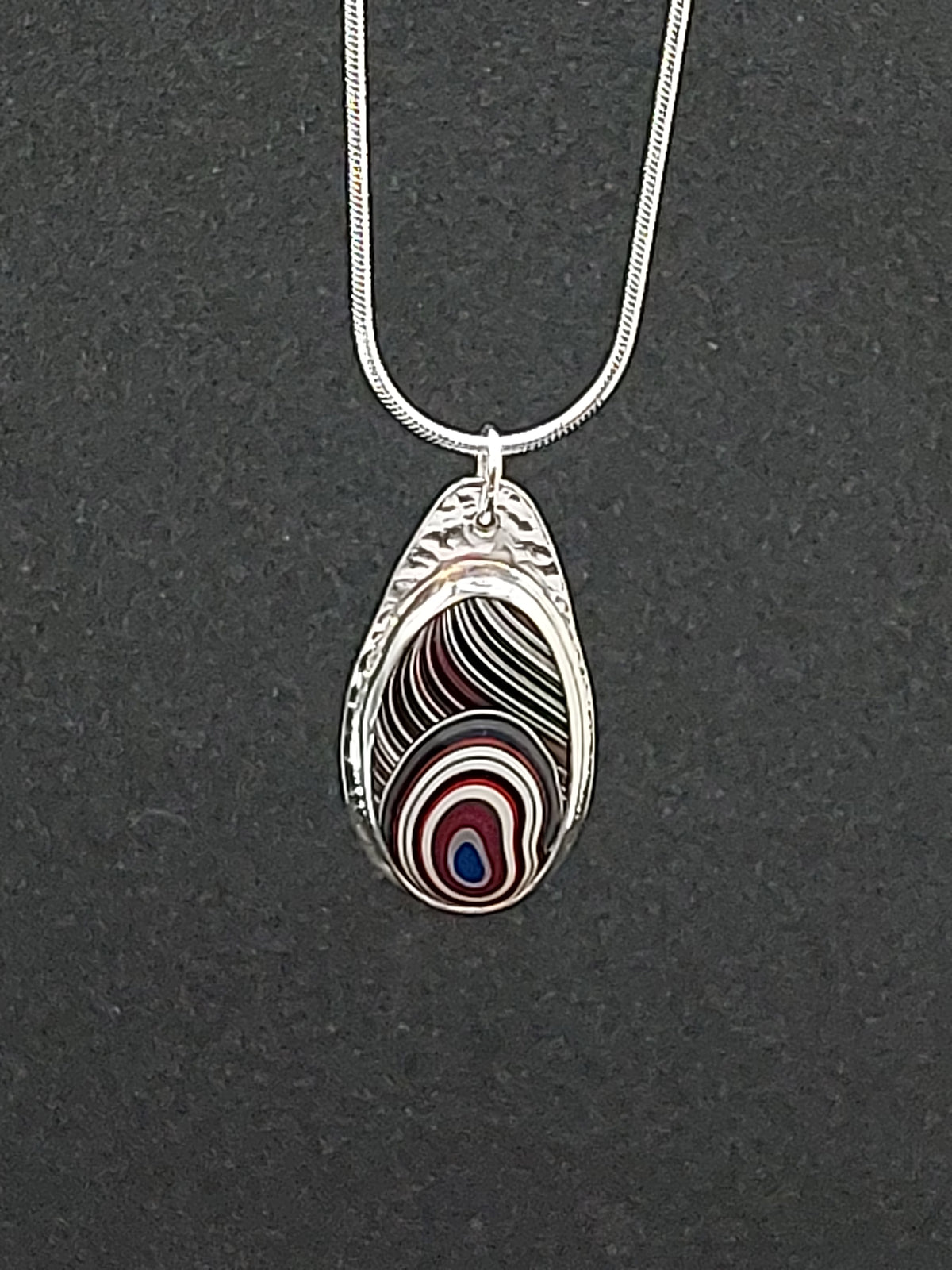 Oval Shaped Fordite Silver Pendant