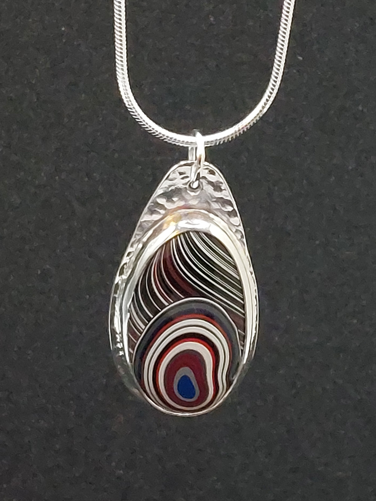 Oval Shaped Fordite Silver Pendant